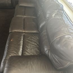 Leather couch in need of seem seeing & dying.