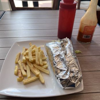 Sultan Restaurant - This is $3 of fries. But the visual of their wrap and fries on their menus is overflowing. Set your expectations accordingly. - Greek Near Me - Miami Beach, Florida Sultan Restaurant - This is $3 of fries. But the visual of their wrap and fries on their menus is overflowing. Set your expectations accordingly. - Greek Near Me - Miami Beach, Florida