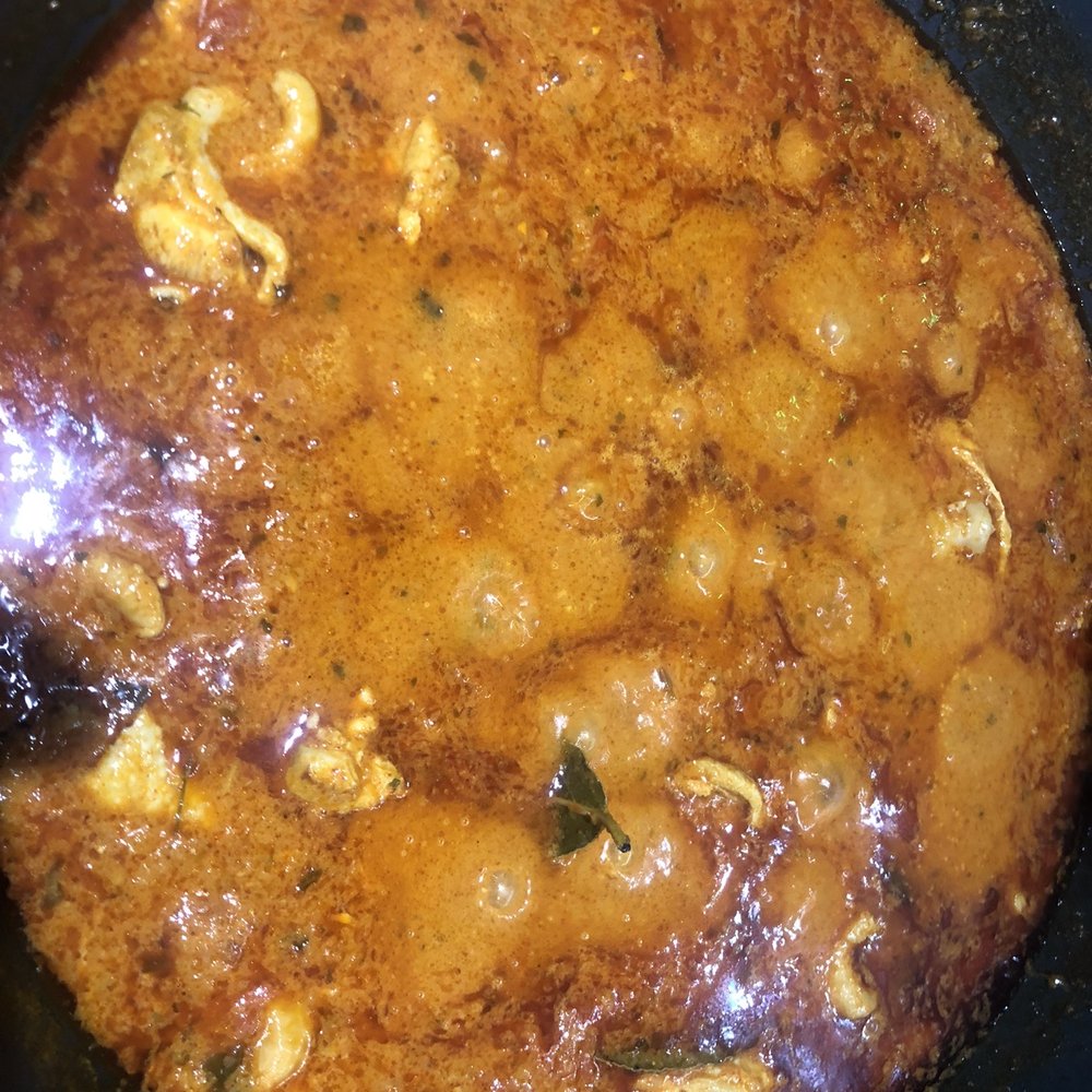 Butter Chicken - a skillet of food cooking on a stove - Indian Near Me - Toronto, Ontario Butter Chicken - a skillet of food cooking on a stove - Indian Near Me - Toronto, Ontario
