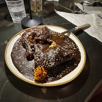 Maderas - Kitchen & Cantina - Mole negro - half chicken in yummy mole sauce - New Mexican Cuisine Near Me - Houston, Texas Maderas - Kitchen & Cantina - Mole negro - half chicken in yummy mole sauce - New Mexican Cuisine Near Me - Houston, Texas