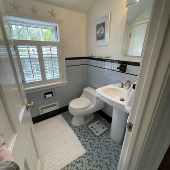 Greenmen Builders - a bathroom with blue and white tiles - General Contractors Near Me Greenmen Builders - a bathroom with blue and white tiles - General Contractors Near Me