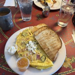 Hawaiian Omelette with their homemade jam and their own sour dough bread. Hawaiian Omelette with their homemade jam and their own sour dough bread.