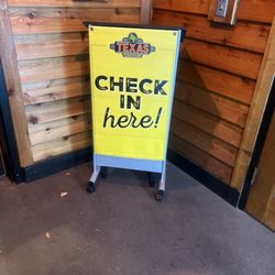 Texas Roadhouse - Check-in sign in front of the restaurant