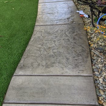 Envision Landscape & Design Corp - a concrete walkway in a backyard - Landscaping Near Me Envision Landscape & Design Corp - a concrete walkway in a backyard - Landscaping Near Me
