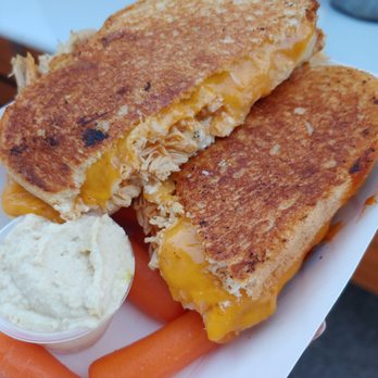 Cheesy Street - Buffalo chicken grilled cheese with bleu cheese, provolone, and cheddar. We got carrots and hummus on the side? - Food Trucks Near Me - Kansas City, Kansas Cheesy Street - Buffalo chicken grilled cheese with bleu cheese, provolone, and cheddar. We got carrots and hummus on the side? - Food Trucks Near Me - Kansas City, Kansas