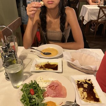 Dolce Osteria - Partially eaten Prosciutto and Burrata and lobster bisque! The phone did not get to eat first. - Italian Near Me - Charlotte, North Carolina