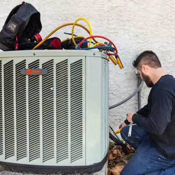 Hagner HVAC - a man working on an air conditioner - Heating & Air Conditioning/HVAC Near Me - Spring City, Pennsylvania