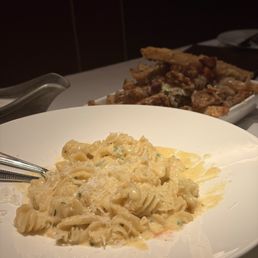 Parmesan truffle fries and their signature Alfredo pasta Parmesan truffle fries and their signature Alfredo pasta