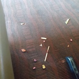 Food on the floor in the aisle and under our table.