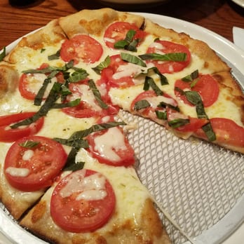 Kozmo's Grille - Fire-roasted tomato basil pizza - American Near Me - Massilon, Ohio Kozmo's Grille - Fire-roasted tomato basil pizza - American Near Me - Massilon, Ohio