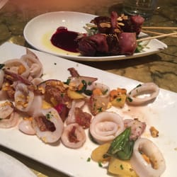 Bar Rio - Delicioso Duck on skewers in back. Succulent and flavorful calamari in the front!