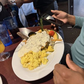 Hash House A Go Go - Country fried steak with gravy, eggs and mashed potatoes - New American Near Me - Orlando, Florida