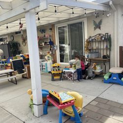 Ira’s Montessori Child Care Home - Outdoor play area, children like to play cooking, construction and using chalkboard