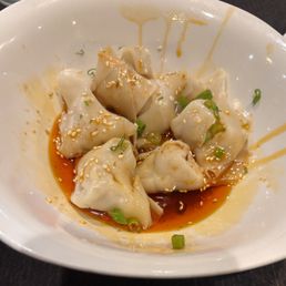 Wontons in chile oil minus the wontons we ate as soon the dish arrived at the table.