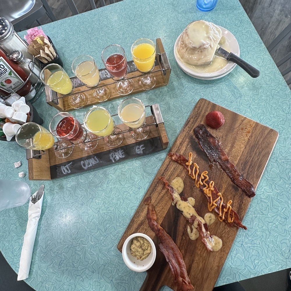 Biscuits Cafe - Bacon Flight, mimosa flights, Cinnamon Roll with the correct amount of frosting - Breakfast & Brunch Near Me - Phoenix, Arizona Biscuits Cafe - Bacon Flight, mimosa flights, Cinnamon Roll with the correct amount of frosting - Breakfast & Brunch Near Me - Phoenix, Arizona