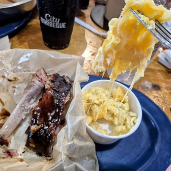 City Barbeque - 5-3-25. One eaten pork spare rib, one not eaten pork spare rib and a side of macaroni and cheese. - Barbeque Near Me - Cary, North Carolina