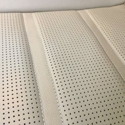 Leather Tech - Soft repair completed with accurate perforations! Accent stitching was protected and color matched perfectly