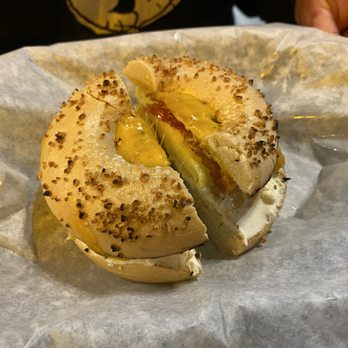 Ozark Mountain Bagel - Garlic bagel sandwich with bacon, egg, and hatch green chile cream cheese - Breakfast & Brunch Near Me - Bentonville, Arkansas Ozark Mountain Bagel - Garlic bagel sandwich with bacon, egg, and hatch green chile cream cheese - Breakfast & Brunch Near Me - Bentonville, Arkansas