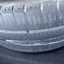 Budget Rent A Car - Tire showing wear through to the steel belt.