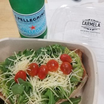 Carmela Coffee - Parkland - Arugula parmesan avocado toast to go, with cherry tomatoes added. - Coffee & Tea Near Me - Parkland, Florida