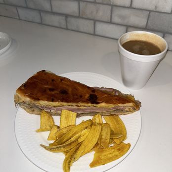 Sandrita’s Latin Eatery - Cuban comes with side of delicious plantain chips. I also got a cafe con leche which is a must! - Cuban Near Me - Tampa, Florida Sandrita’s Latin Eatery - Cuban comes with side of delicious plantain chips. I also got a cafe con leche which is a must! - Cuban Near Me - Tampa, Florida