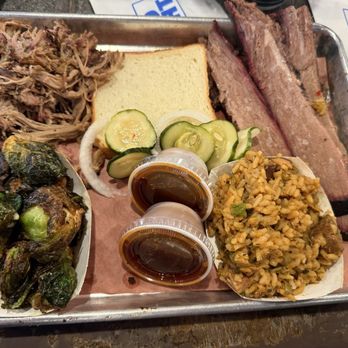 Central City BBQ - Pulled pork, bread, prime brisket, jambalaya, Brussels, pickle and onion - Barbeque Near Me - New Orleans, Louisiana
