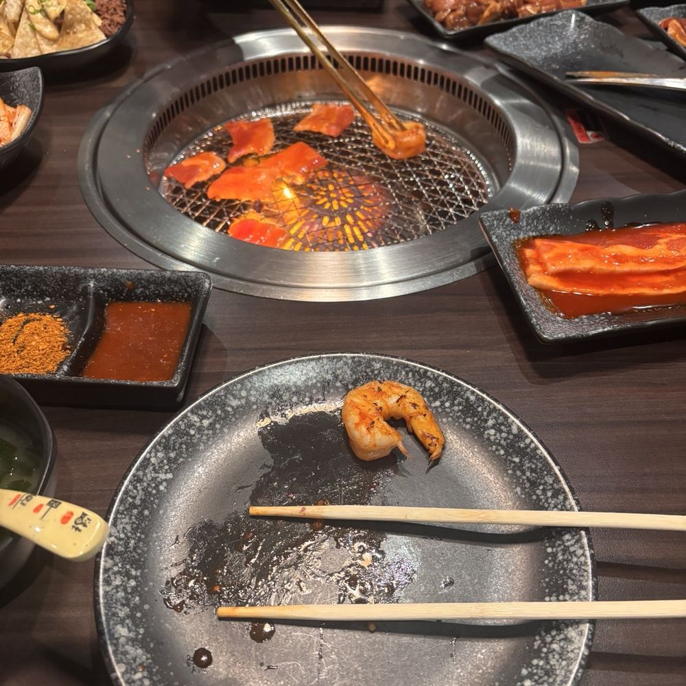Array of meats being grilled Array of meats being grilled