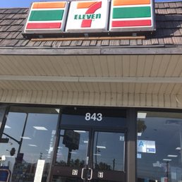 the front of a 7 - eleven restaurant the front of a 7 - eleven restaurant