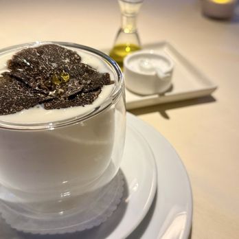 BCN Taste & Tradition - Poached Quail Egg Immersed in Potato Foam, Seasonal Truffle - Catalan Near Me - Houston, Texas BCN Taste & Tradition - Poached Quail Egg Immersed in Potato Foam, Seasonal Truffle - Catalan Near Me - Houston, Texas