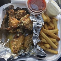 5 Garlic wings and fries combo . Comes with a drink for around 8 dollars 5 Garlic wings and fries combo . Comes with a drink for around 8 dollars
