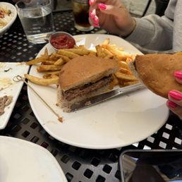 Burger and fries. Gluten free bun. Definitely well seasoned and cook as asked