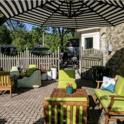 Art of Joy - Art of Joy has beautiful outdoor spaces right on Cedar Creek and also facing the village.