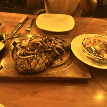 Primal Steakhouse - 24oz tomahawk with onion and mushrooms - Steakhouses Near Me - Las Vegas, Nevada Primal Steakhouse - 24oz tomahawk with onion and mushrooms - Steakhouses Near Me - Las Vegas, Nevada