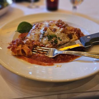 Il Poggiolo - a plate of food on a table - Italian Near Me - Hinsdale, Illinois Il Poggiolo - a plate of food on a table - Italian Near Me - Hinsdale, Illinois
