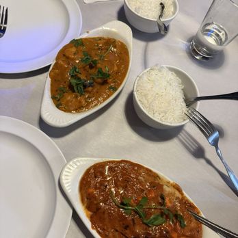 Sajna Indian Cuisine - Chicken Mango (left) and the Paneer Tikka Masala (right) accompanied with Butter Naan and Garlic Naan - Indian Near Me - Hollywood, Florida Sajna Indian Cuisine - Chicken Mango (left) and the Paneer Tikka Masala (right) accompanied with Butter Naan and Garlic Naan - Indian Near Me - Hollywood, Florida