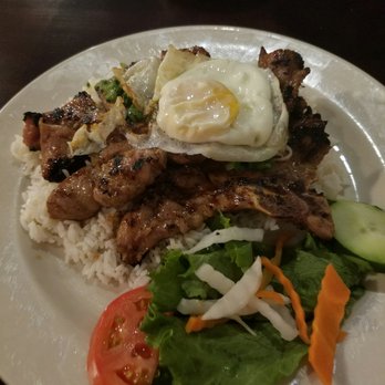 Pho Dakao - Grilled pork chop rice plate topped with a egg. - Vietnamese Near Me - Framingham, Massachusetts Pho Dakao - Grilled pork chop rice plate topped with a egg. - Vietnamese Near Me - Framingham, Massachusetts