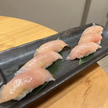 Naamah Sushi - two pieces of sushi on a black plate - Sushi Bars Near Me - Boca Raton, Florida Naamah Sushi - two pieces of sushi on a black plate - Sushi Bars Near Me - Boca Raton, Florida