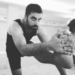Hot Yoga - Standing Head-to-Knee Pose (Dandayamana Janushirasana). Challenge your balance and focus with this full body strengthening pose.