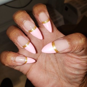 Tranquility Salon & Spa - My stiletto nails with a pink French manicure with gold accent. I love them and they came out beautifully. - Nail Salons Near Me - Middletown, New York