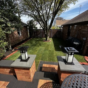 ZCanales Landscaping - a backyard with a lawn and a fire pit - Landscaping Near Me ZCanales Landscaping - a backyard with a lawn and a fire pit - Landscaping Near Me