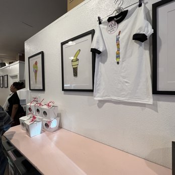 Cream Bean Berry - a pink counter with a white t - shirt hanging on it - Ice Cream & Frozen Yogurt Near Me - Durango, Colorado