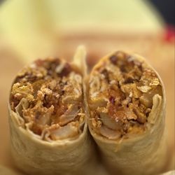 Nick's Deli II - BREAKFAST BURRITO: EGGS, CHORIZO, BACON, POTATOES & CHEESE (GET IT TOASTED!) | $9.95