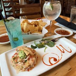 Villa Montez - Beautiful and excellent Shrimp ceviche with a blue coconut jalapeño mojito and Topo Chico. Beautiful presentation and flavors!