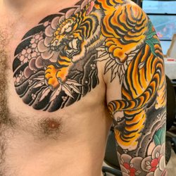 Inkman Tattoo - Tiger chest and sleeve.