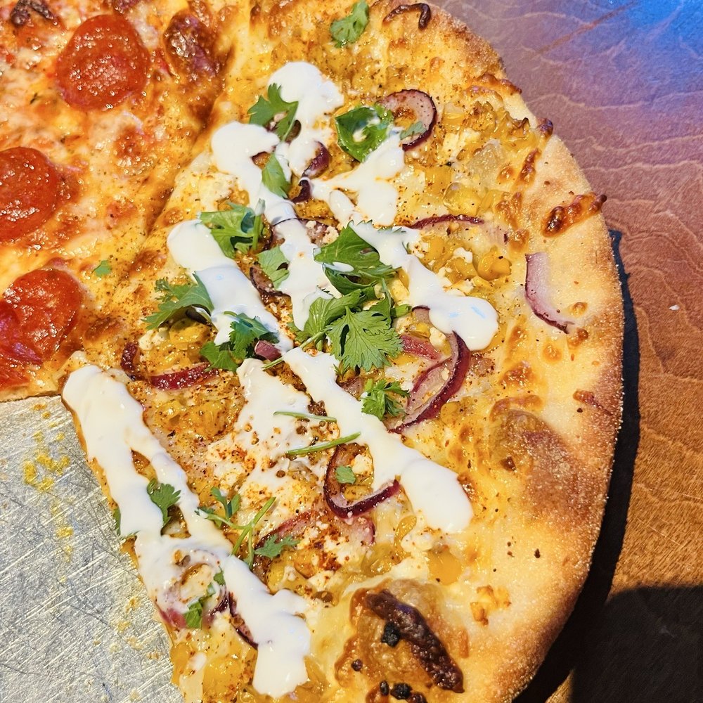 Half elote and half pepperoni pizza Half elote and half pepperoni pizza