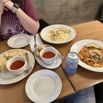 Vignolas Italian Kitchen - From left to right clockwise. Focaccia, fried mozzarella, fettuccine alfredo w/shrimp, and pappardelle bolognese. - Italian Near Me - Edmond, Oklahoma