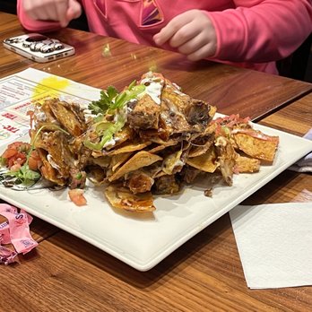 Guy Fieri's Branson Kitchen + Bar - Trash can nachos - Bars Near Me - Branson, Missouri Guy Fieri's Branson Kitchen + Bar - Trash can nachos - Bars Near Me - Branson, Missouri