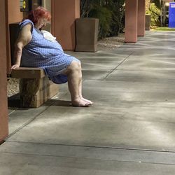 St Mary Medical Center - Discharged patient out front of the hospital helpless for hours.