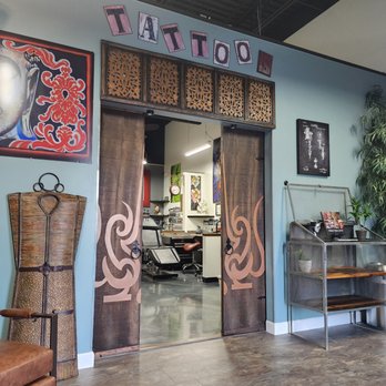 Forbidden Images Tattoo Studio - Center view looking back into Artists stations. Our logo printed on custom wood door. - Tattoo Near Me - Trinity, Florida Forbidden Images Tattoo Studio - Center view looking back into Artists stations. Our logo printed on custom wood door. - Tattoo Near Me - Trinity, Florida