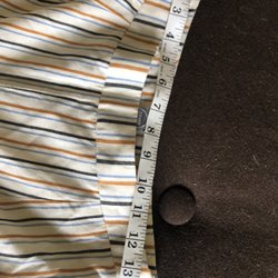 MOD Boutique - Hard to tell from the picture, but the back is 13.5 inches, and the front is 15" from seam to seam.